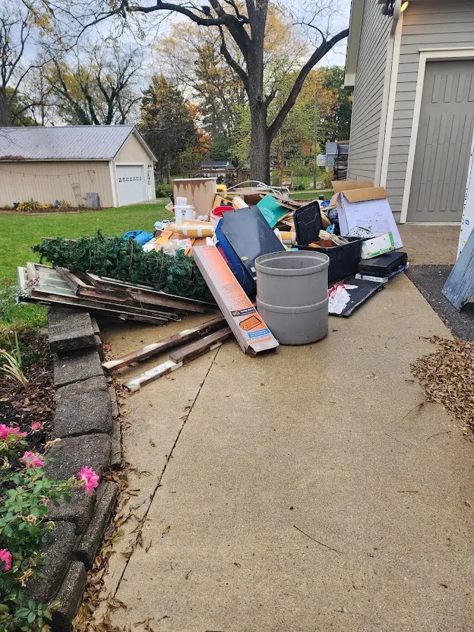 Dumpster being loaded with debris for Estate Cleanout Dumpster Rental in Orcutt